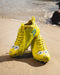 Phenom Elite SpongeBob cleat lifestyle photo — close-up on field