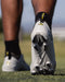 Phenom Elite Warhawk cleat lifestyle photo — athlete in action wearing Quantum Speed 2.0 cleats