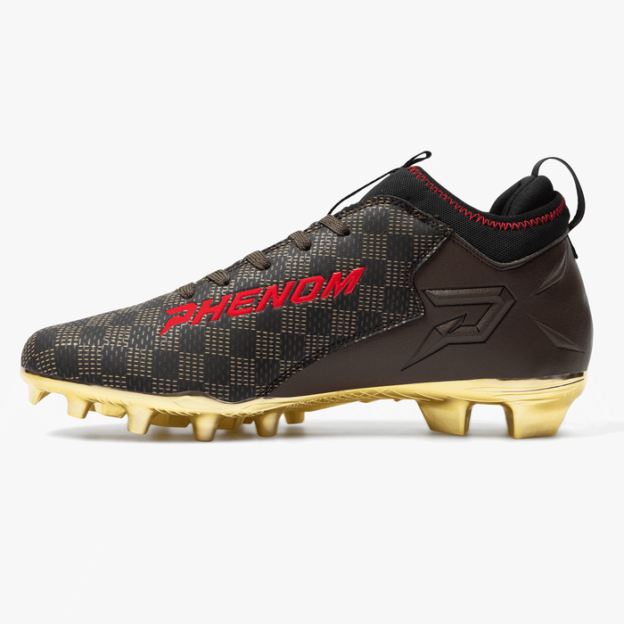 Luxury Warhawk football cleat detail: gold hatch weave, black overlays and red shark-teeth artwork