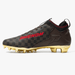 Luxury Warhawk football cleat detail: gold hatch weave, black overlays and red shark-teeth artwork