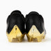 Phenom Elite Quantum Carbon Gold Rush Black & Gold cleat — side profile, low-cut speed silhouette