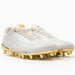 Phenom Elite Quantum Carbon Gold Rush White & Gold cleat — white carbon-plate low-cut speed cleat with metallic gold accents, hero shot