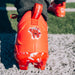 Phenom Elite Kool-Aid Cherry cleat lifestyle photo — cleats with packet 2