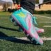 Phenom Elite Kool-Aid Sharkleberry Fin cleat lifestyle photo — cleats with packet 2