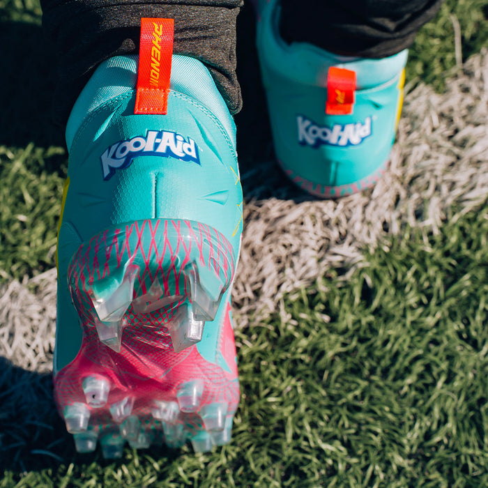 Phenom Elite Kool-Aid Sharkleberry Fin cleat lifestyle photo — cleats with packet 3