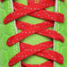 Phenom Elite Raphael cleat — close-up of laces and red-mask detailing
