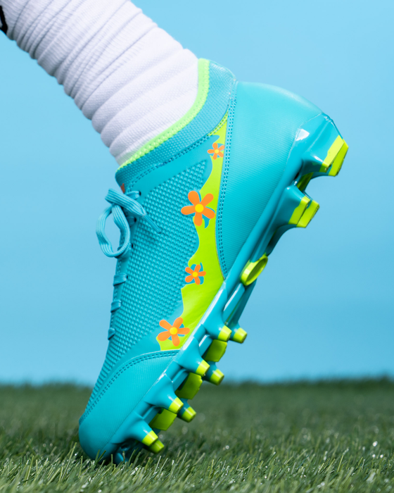 Phenom Elite Scooby-Doo cleat lifestyle photo — product detail on field