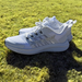 Phenom Elite Quantum Pulse training shoe — lifestyle shot on grass